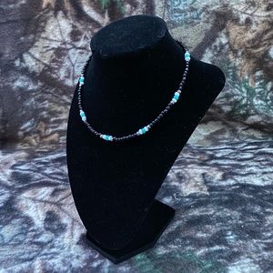 teal, black, white, and silver choker necklace
